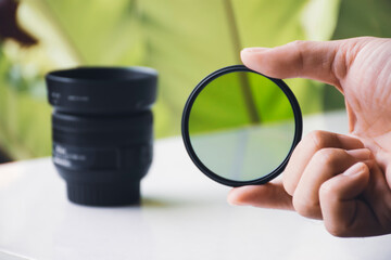 CPL filter of camera lens in the hand
