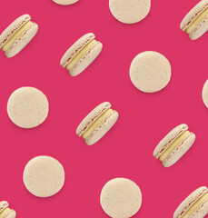 Delicious macarons on pink background, flat lay