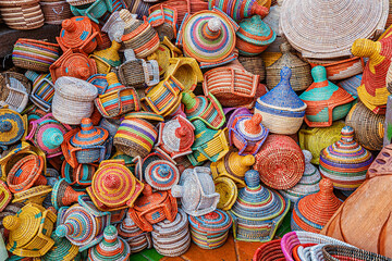 A large pile of various wicker hand made baskets for sale on the local African market. Traditional craftsmanship and art hobby concept