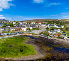 Fototapeta na wymiar An aerial view towards the south side of Portree on the Isle of Skye, Scotland on a summers day