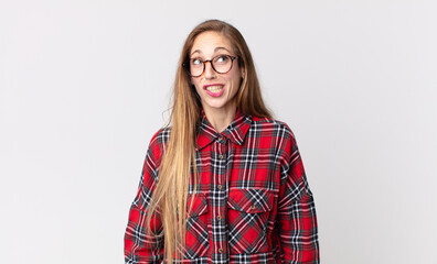 pretty thin woman looking goofy and funny with a silly cross-eyed expression, joking and fooling...
