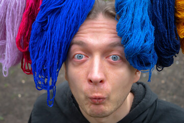 portrait man with threads, woolen yarn