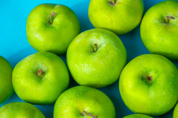 green apples on blue background, fruits