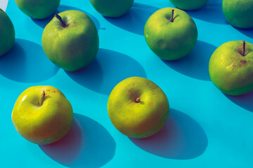 green apples on blue background, fruits