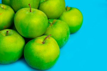 green apples on blue background, fruits