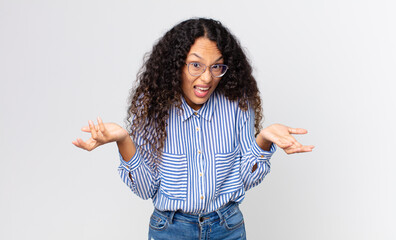 pretty hispanic woman feeling clueless and confused, not sure which choice or option to pick,...