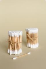 Fototapeta na wymiar Bamboo cotton swabs on neutral background. Zero waste, plastic free lifestyle concept
