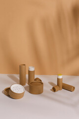 Recyclable paper tube with paper cap, cardboard container for packaging isolated on white background with copyspace, mockup. Recyclable packaging and zero waste concept