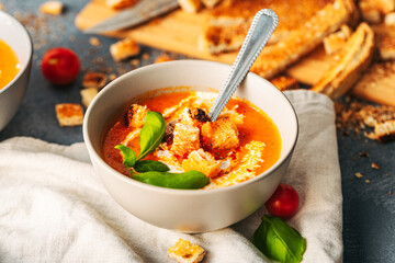 Tomato soup. Tomato creme with basil and bread.  Bowl with italian tomato soup.  - obrazy, fototapety, plakaty
