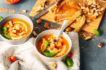 Tomato soup. Tomato creme with basil and bread.  Bowl with italian tomato soup. 