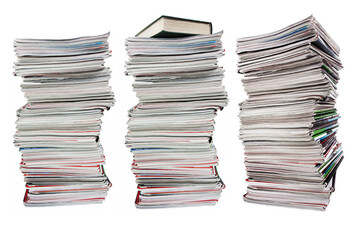 Tall stack of old magazines on white background