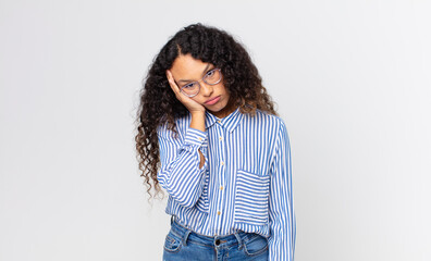 pretty hispanic woman feeling bored, frustrated and sleepy after a tiresome, dull and tedious task,...