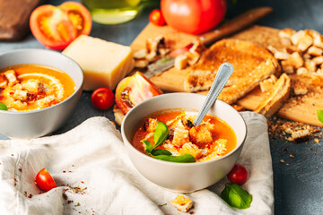 Tomato soup. Tomato creme with basil and bread.  Bowl with italian tomato soup.  - obrazy, fototapety, plakaty