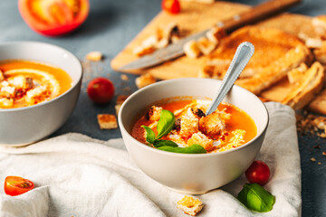 Tomato soup. Tomato creme with basil and bread.  Bowl with italian tomato soup. 