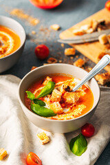 Tomato soup. Tomato creme with basil and bread.  Bowl with italian tomato soup. 