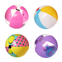 Set with different inflatable beach balls on white background