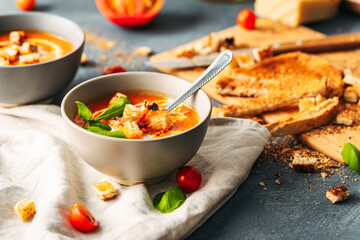 Tomato soup. Tomato creme with basil and bread.  Bowl with italian tomato soup. 