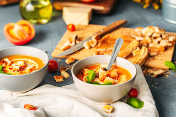 Tomato soup. Tomato creme with basil and bread.  Bowl with italian tomato soup. 