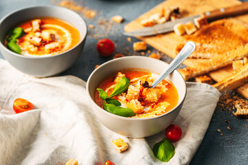 Tomato soup. Tomato creme with basil and bread.  Bowl with italian tomato soup. 