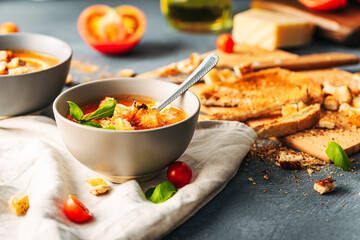 Tomato soup. Tomato creme with basil and bread.  Bowl with italian tomato soup. 