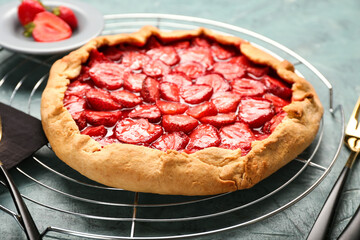 Tasty strawberry pie on table