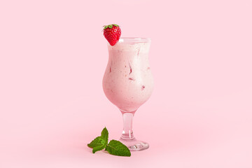 Glass of strawberry Pina Colada cocktail on color background