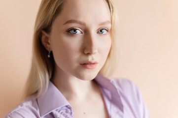 Portrait of a beautiful young woman with blue eyes.