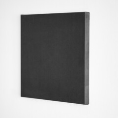 Black canvas mockup hanging on white wall. Square artistic canvas