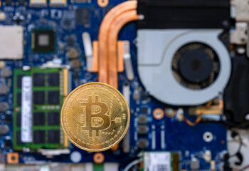 gold bitcoin coin and circuits behind it. next generation investment cryptocurrency.