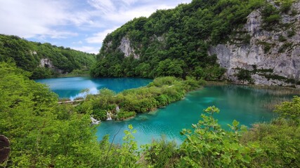 Naklejka na ściany i meble Blue lakes in the middle of rocks and forests. Plitvice Lakes National Park.