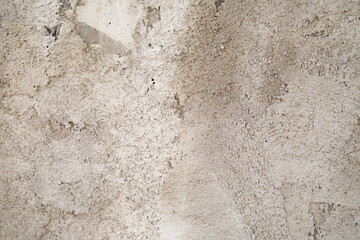Textured beige plastered surface, close-up.