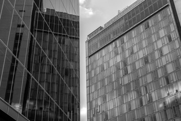 Two office buildings with a reflection
