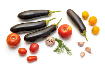 Eggplants, tomatoes, garlic on the table on a white background. Set about cooking a delicious...