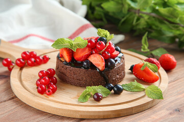 Chocolate tart with berries and mint