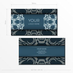 Preparing a business card in Blue with luxurious light ornaments. Business card design printable template with vintage patterns.