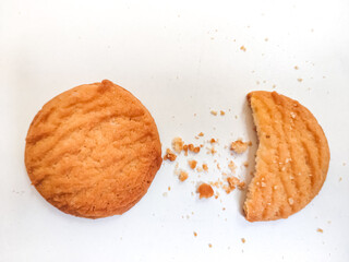 Fresh Homebaked Wheat biscuits or Cookies isolated in a White background with selective focus and copy space for inscription. 