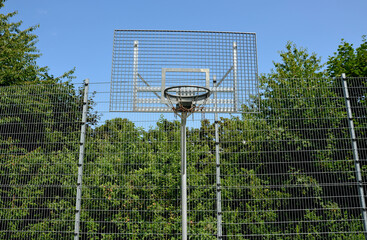 multifunctional outdoor playground for ball games at school. green artificial turf from a plastic...