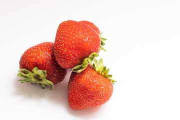 Fresh strawberries were placed on a white background