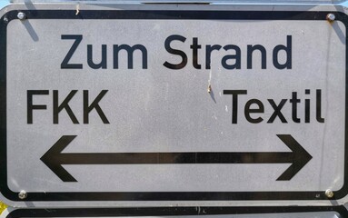 Sign at the beach indicating the nudist beach in German language
