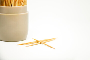 Group of Toothpick in container isolated on white background, Toothpick is a piece of wooden, small. Tableware.