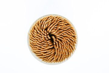 Toothpicks in a round box isolated on white background on with clipping path. Top view