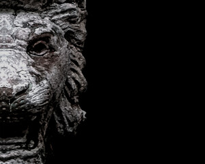 Creepy Lion Head Sculpture Over Black