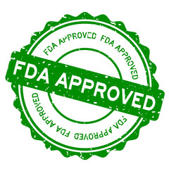 Grunge green FDA (abbreviation of Food and Drug Administration) approved word round rubber seal stamp on white background