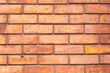 Grunge old red orange brick pattern wall textured background.