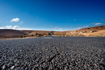Asphalt road from a low point of view