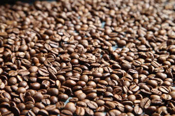 Coffee beans background. Roasted aromatic coffee beans