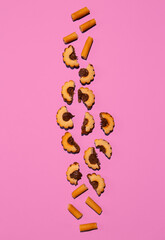 Biscuit cookies set on pink background. Flat lay scene. Minimal art. Holidays time, present,  winter christmas celebration stylish wallpaper