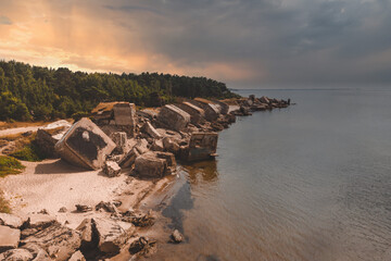 Ruins of bunkers on the beach of the Baltic sea, part of an old fort in the former Soviet base Karosta in Liepaja, Latvia.