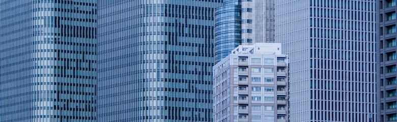 futuristic blue modern crowded tall office and apartment buildings close up view banner
