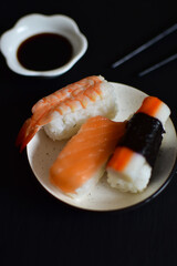 seafood sushi and black chopsticks